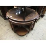 Reproduction mahogany circular nest of five coffee tables, together with a mid 20th Century coffee