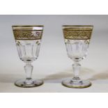 Pair of Baccarat gilt and cut pedestal wine glasses 12cm high In good condition