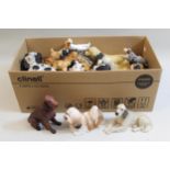 Quantity of various ceramic and composite figures of dogs