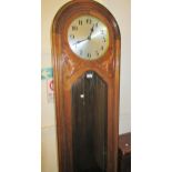 Early 20th Century walnut longcase clock, the circular silvered dial with Arabic numerals and