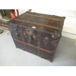 A ' New Atlas ' wooden and iron mounted steamer trunk / chest with original canvas covering