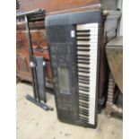 Yamaha electronic keyboard with various accessories