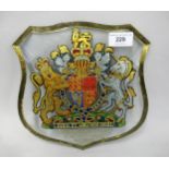 Reverse decorated bevelled glass shield shaped wall plaque ' By Appointment to HM the Queen