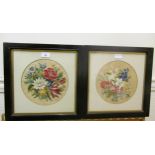 Pair of circular mounted embroidered floral still life pictures, 22cms diameter, housed in