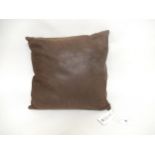 Gucci, brown leather cushion, with original price ticket 36cms square