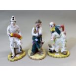 Three Coalport Cavalcade of Clowns figures 'Woeful Tramp', 'August Mishap', and 'White Faced