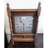 Arts & Crafts oak cased bracket clock, the silvered dial with Roman numerals and three train