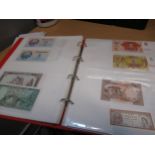 Two folders containing a quantity of World bank notes