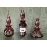 Three ruby glass perfume bottles by Laugharne All three in good condition. No chips or cracks noted.