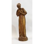 Late 19th / early 20th Century Continental carved lime wood figure of a girl at prayer, on an
