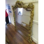 Large 19th Century French gilt composition wall mirror with floral pierced surmount and borders,