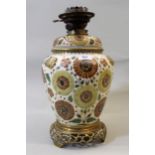 Zsolnay type pottery and brass mounted oil lamp base with stylised floral decoration, 41cms high