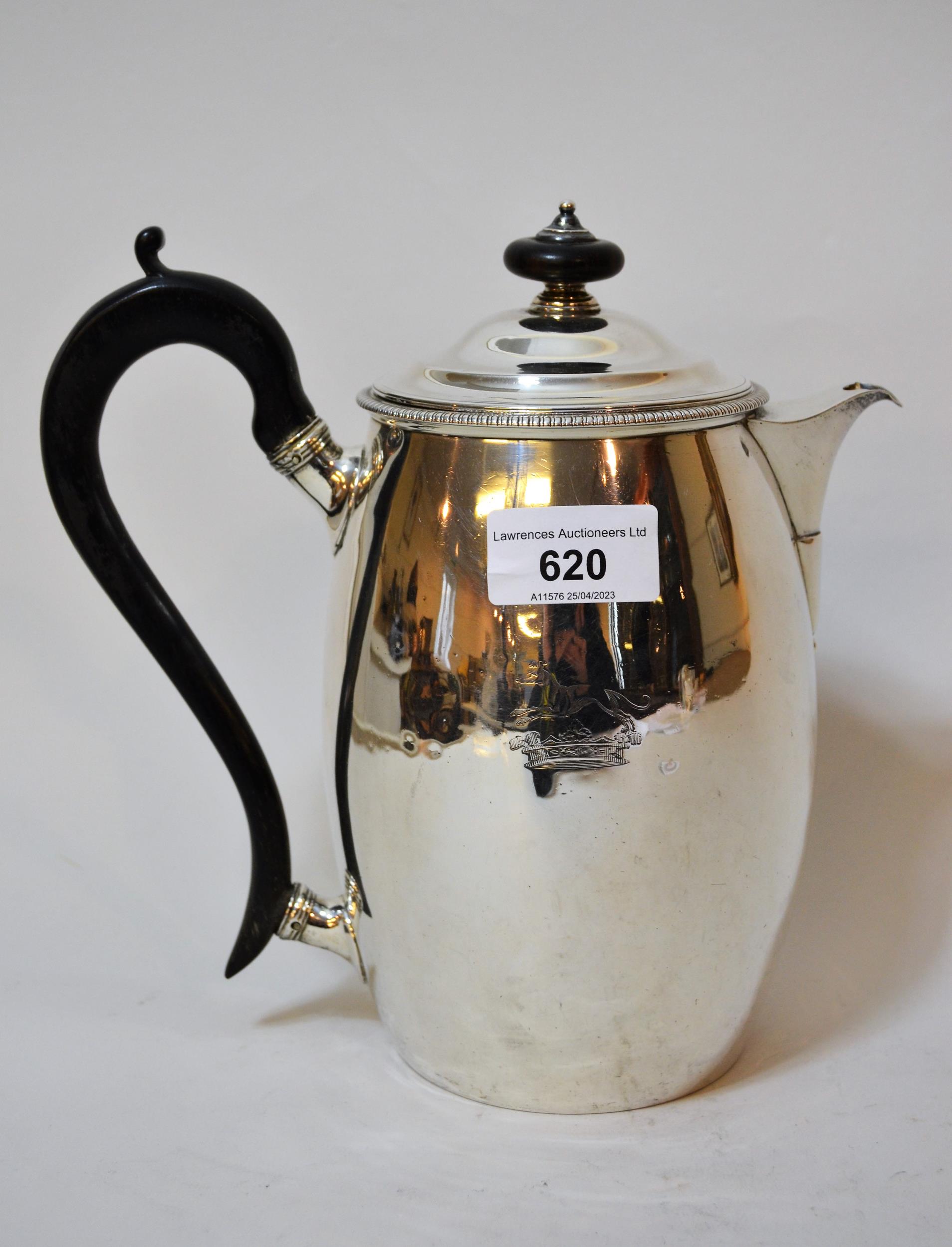 George III London silver hot water pot of plain form with ebonised handle and engraved crest dated