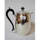 George III London silver hot water pot of plain form with ebonised handle and engraved crest dated