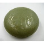 Small 20th Century carved pale green jade circular box and cover, decorated in shallow relief, 8.5cm