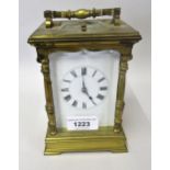 20th Century brass cased carriage clock, the enamel dial with Roman numerals and two train repeating