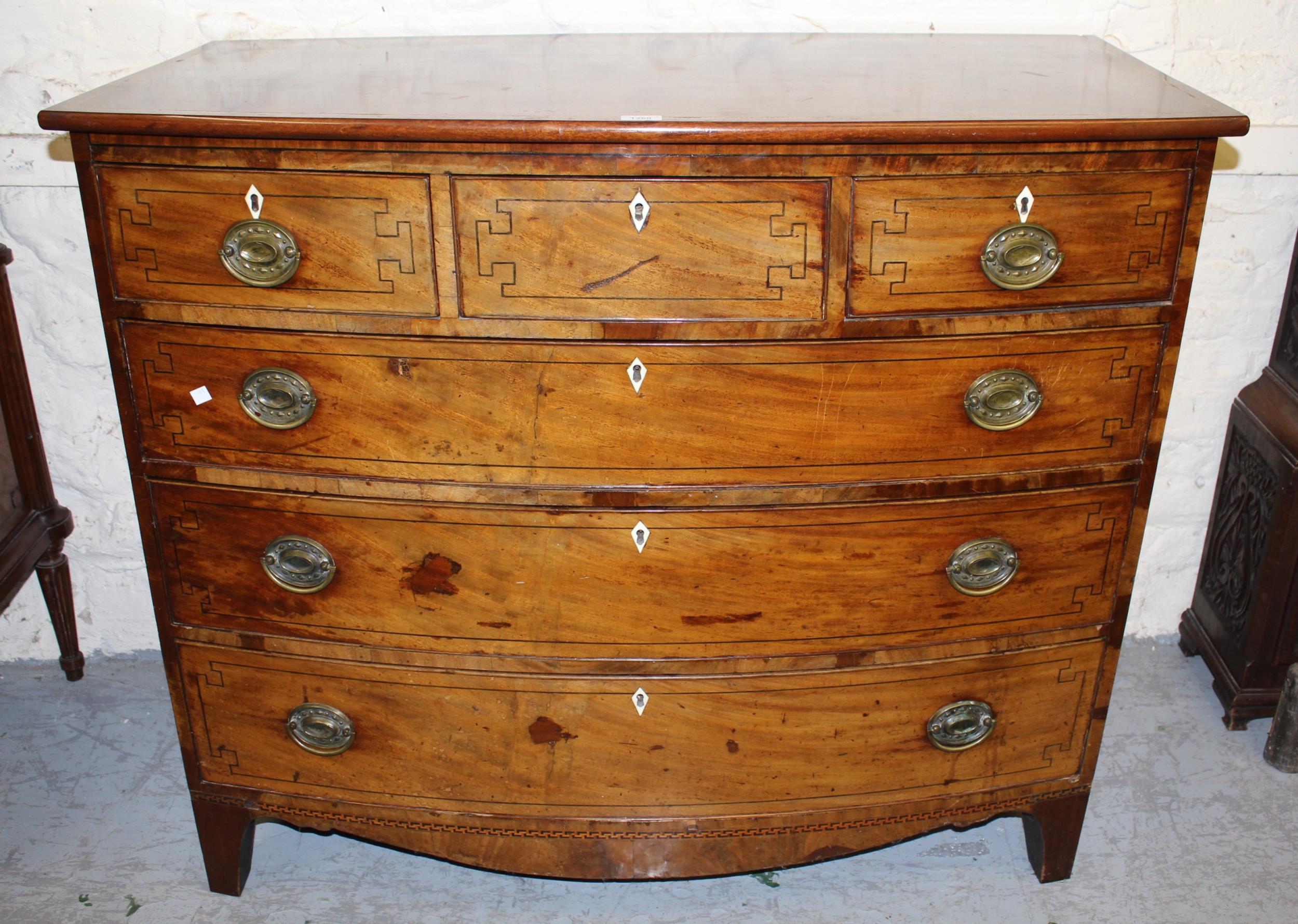 George III mahogany chequer banded and line inlaid bow front chest of three short and three long
