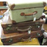 Two early 20th Century leather suitcases together with a hat box