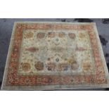 Indo Persian carpet with an all-over flowerhead and vase design on an ivory ground with borders, (