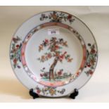 18th Century Chinese circular wall plate painted with a flowering tree, 28cms diameter (at fault)