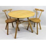 Mathers & Hirst, circular oak table on three turned supports, 88cms diameter, together with a pair