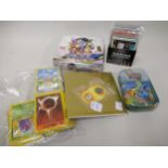 Box containing a quantity of Pokemon cards including base set Commons, Energy and some Holo's,