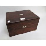 Victorian rosewood and mother of pearl inlaid dressing case, the hinged cover enclosing a fitted