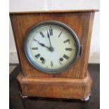 19th Century Continental walnut mantel clock, the circular enamel dial with Roman numerals, with a