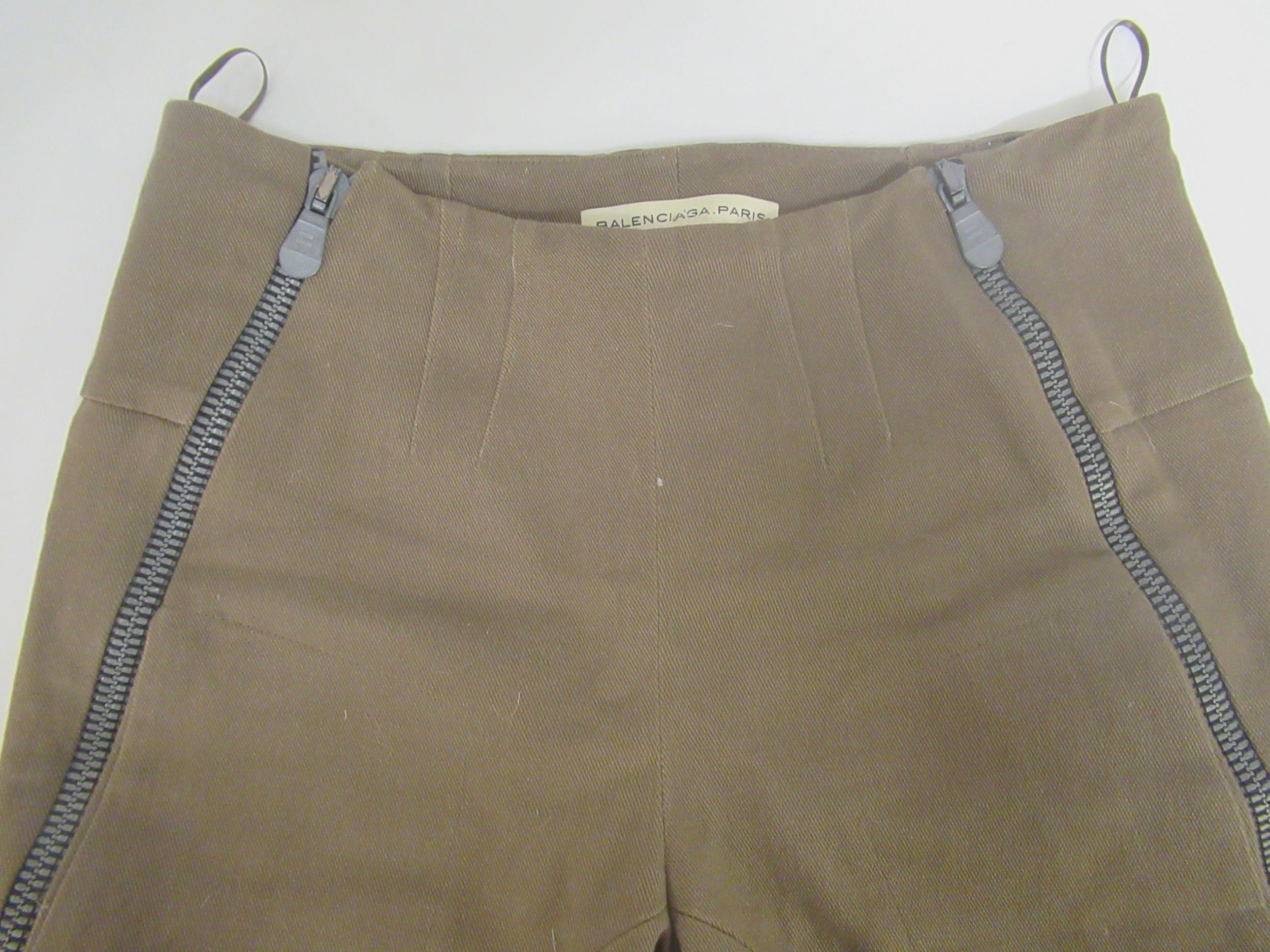 Balenciaga, pair of ladies trousers, size 36, together with two N. Peal, London, knitted dresses,