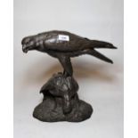 Bronzed composition figure of an eagle with prey, together with a small figure of a horse