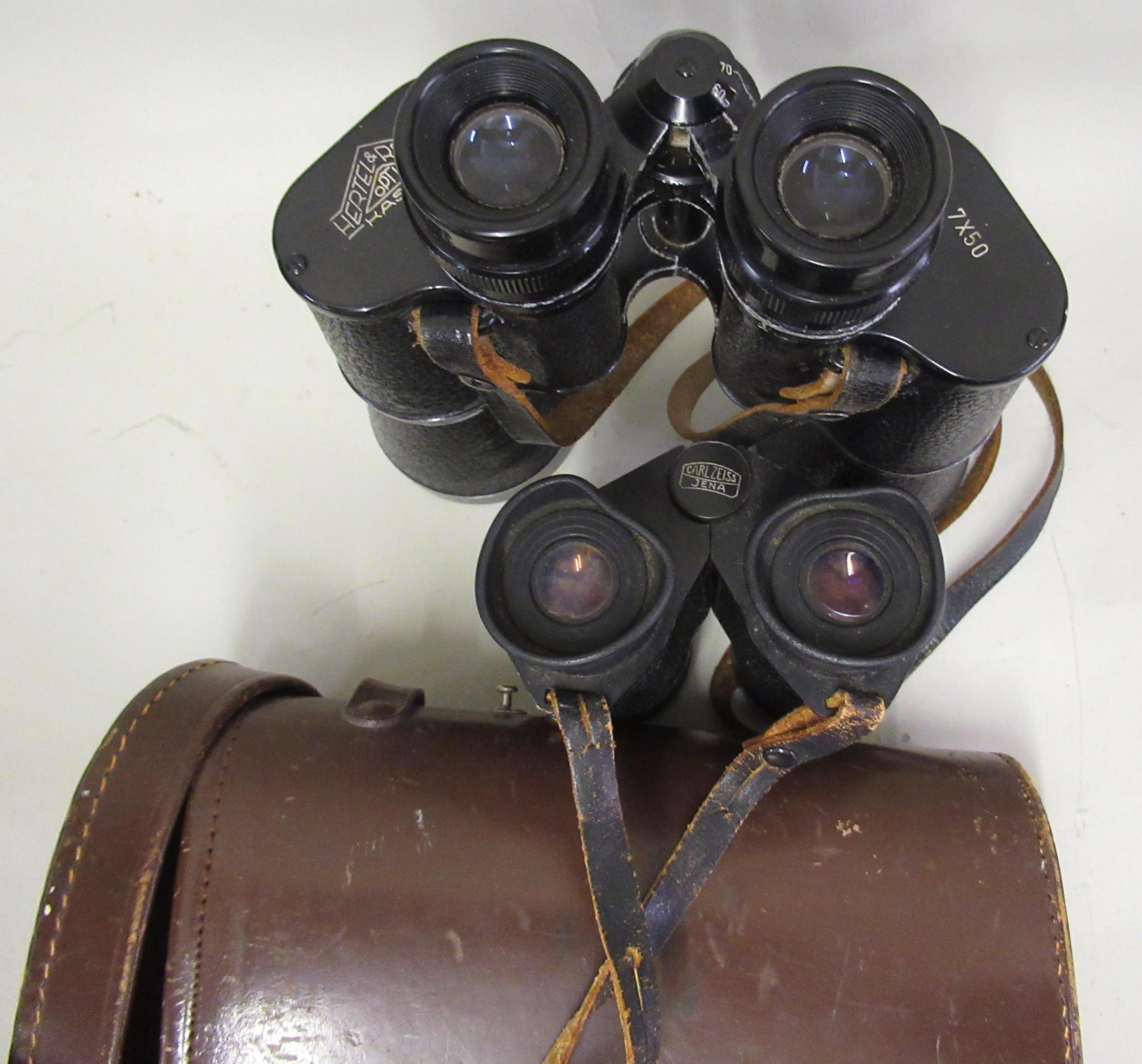 Pair of German leather cased 7x50 binoculars by Hertel & Reuss, and a pair of Carl Zeiss Jena travel