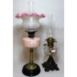 Victorian brass oil lamp, with peach glass well and etched shade, together with another iron and