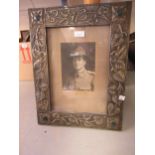 Art & Crafts embossed pewter photograph frame with inset ceramic roundels, 47.5cms x 36cms Good