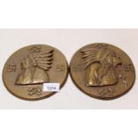Two cast bronze plaques, decorated with high relief native American Indian chiefs 17cm diameter each