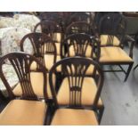 Harlequin set of twelve (ten plus two) late 19th Century mahogany dining chairs in Hepplewhite