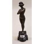 Paul Phillippe, patinated bronze figure of a nude girl, mounted on a moulded marble plinth base,