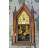 American Gothic style two train mantel clock (at fault), together with a similar wall clock No