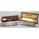 Two Hohner harmonicas, in original fitted boxes