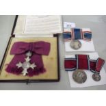 George VI cased M.B.E. with ladies bow, together with George V and George VI coronation medals and