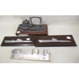 1961 Polished aluminium model of a Greek ship, two miniature half hull metal models on Bakelite