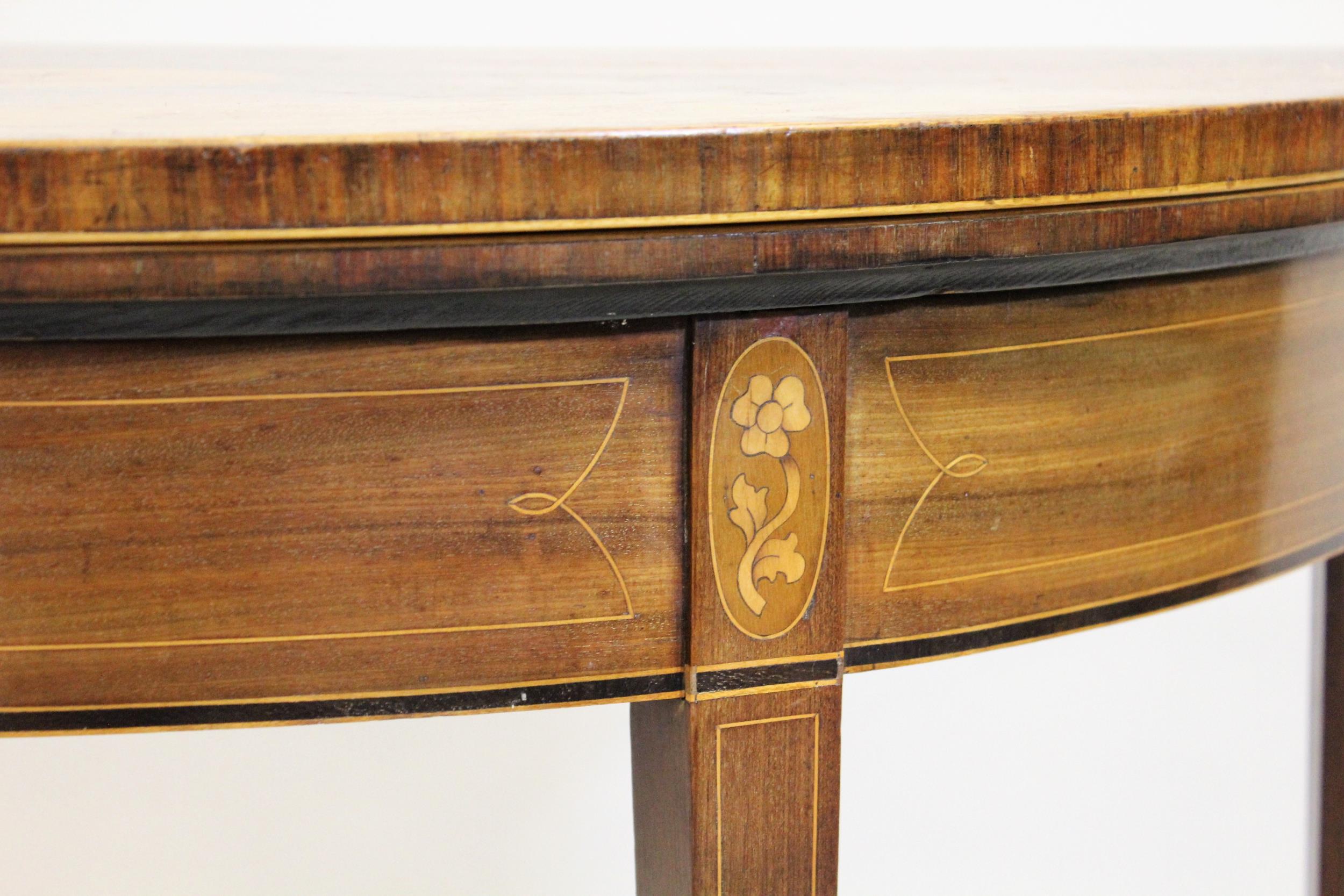 George III mahogany and inlaid demi lune card table, the fold-over top enclosing a baize lined - Image 3 of 3