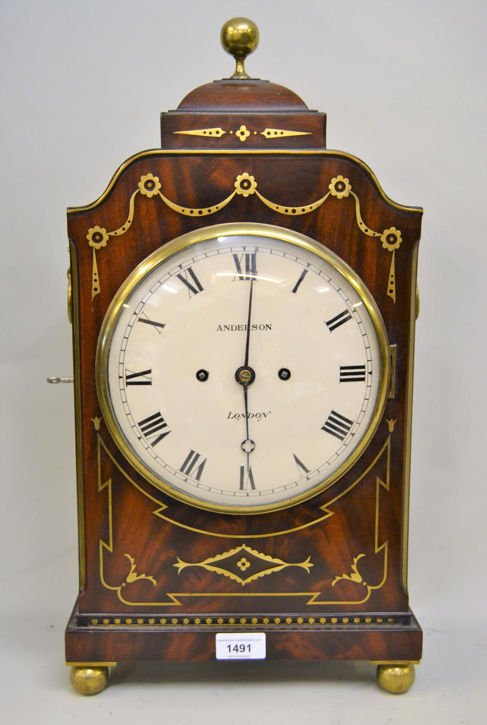 Regency mahogany and cut glass inlaid bracket clock of flattened break arch design, the circular