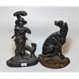 Two black painted cast iron doorstops, in the form of a man and a dog