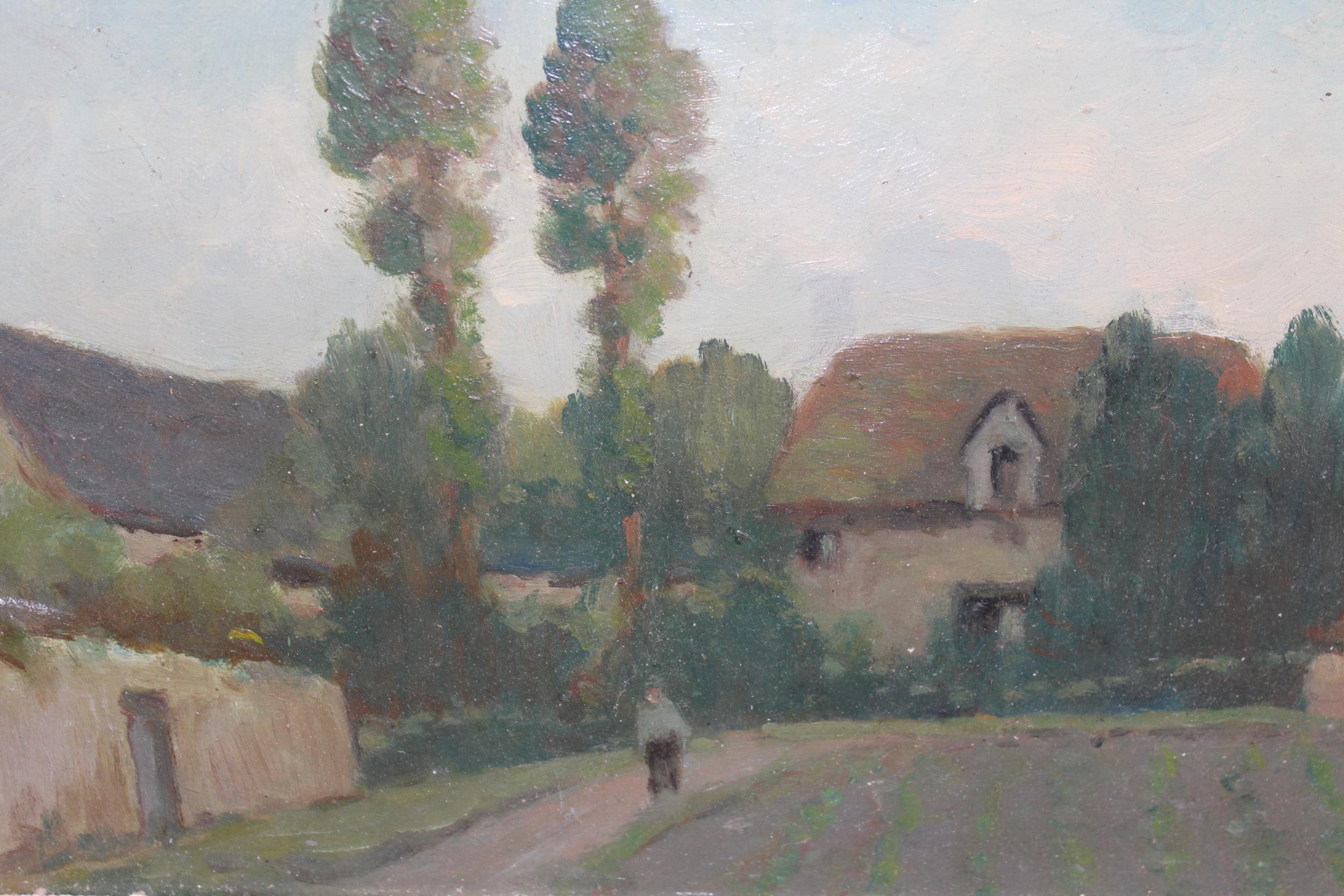 Early 20th Century French impressionist style oil on board, figure on a lane before cottages,