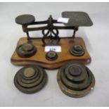 Pair of early brass postal scales with weights, together with two further part sets of brass weights