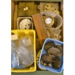 Various boxes containing a quantity of clock parts, dials, pendulums, movements etc., together