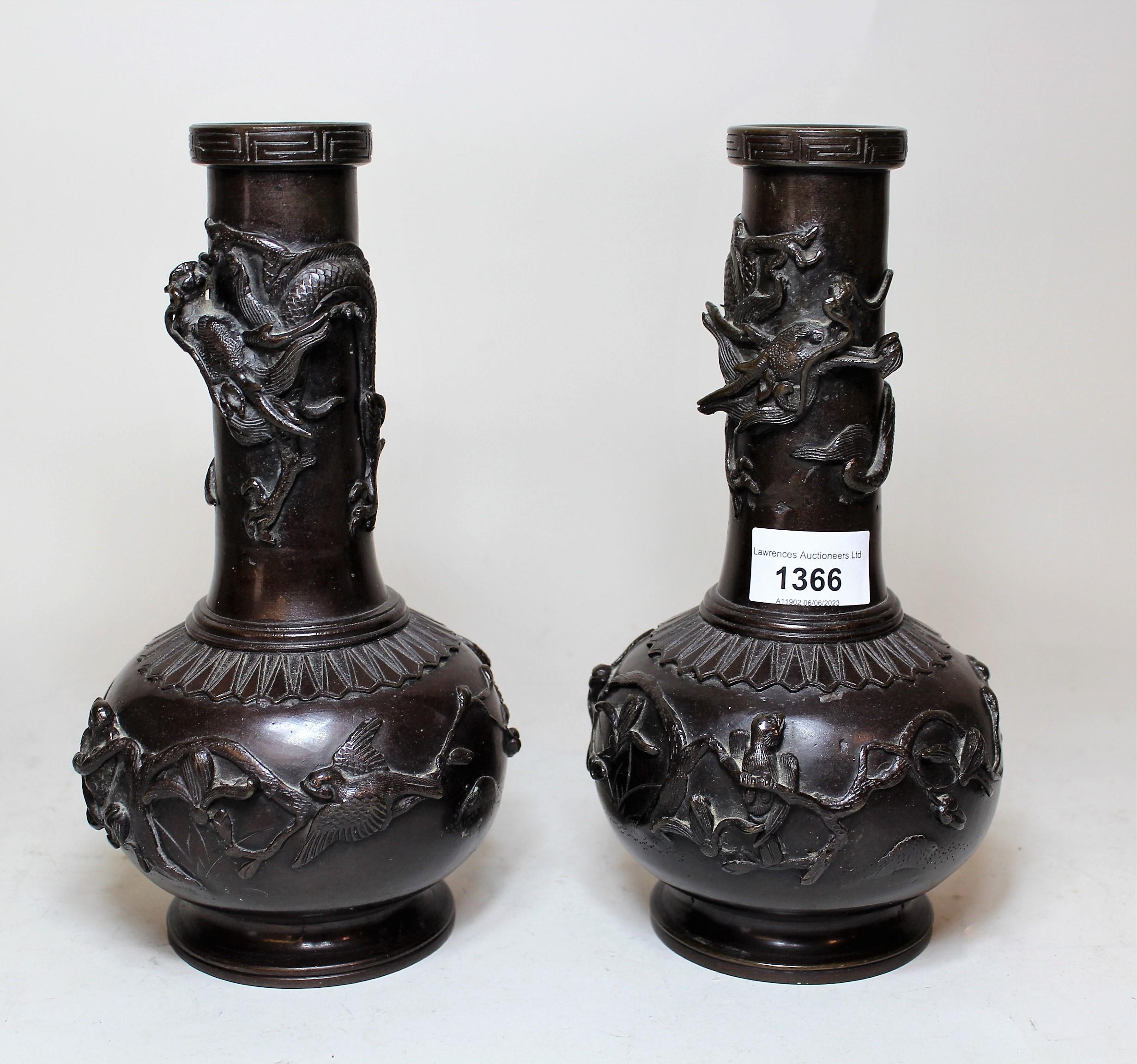 Pair of Japanese bronze, baluster form narrow neck vases, relief decorated with birds and a