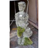 20th Century weathered cast concrete figure of a seated faun