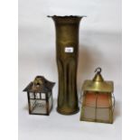 Two small Art Nouveau brass lanterns together with a Trench Art shell case adapted for use as a vase