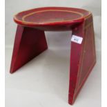 Continental circular red lacquer decorated stool, 31cms diameter